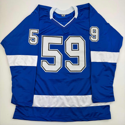 Blue and white striped hockey jersey with white-outlined numbers 59 and 5 on sleeves, displayed flat against white background.