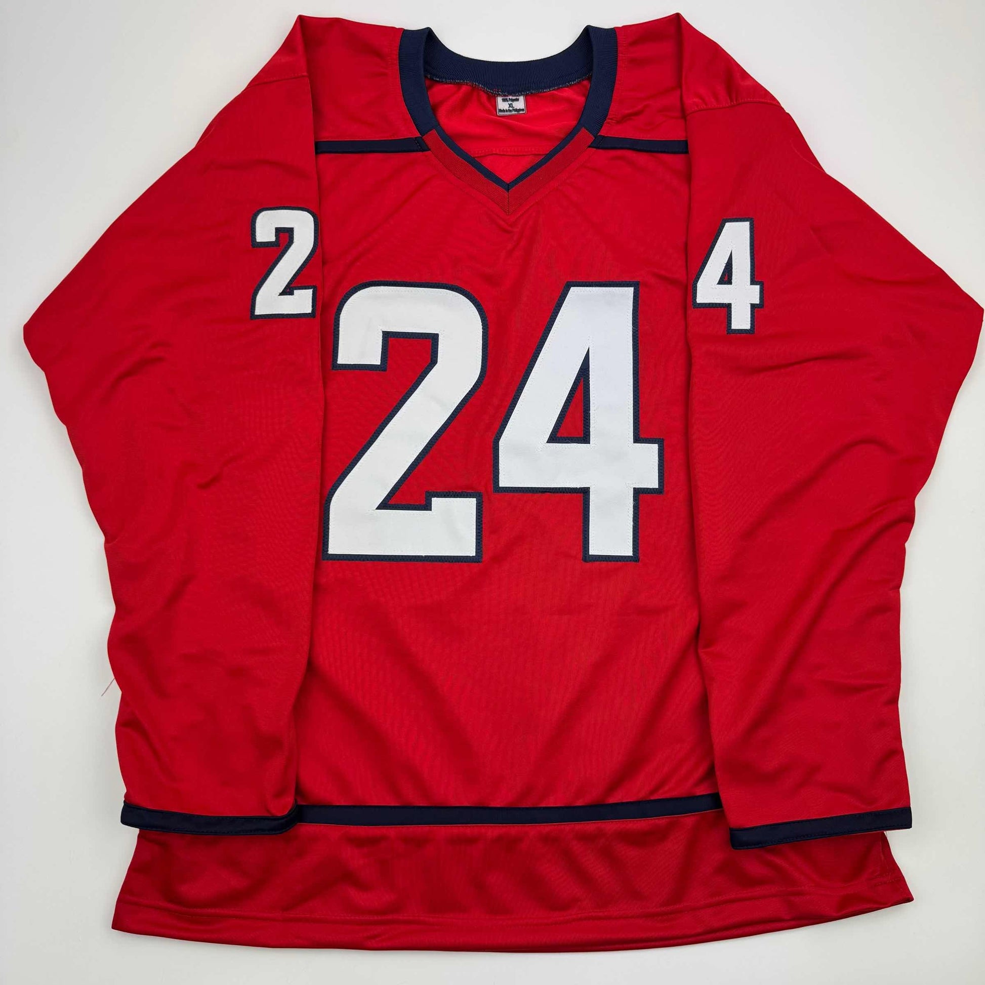 Red hockey jersey with white and navy number 24 displayed flat against white background, front view.