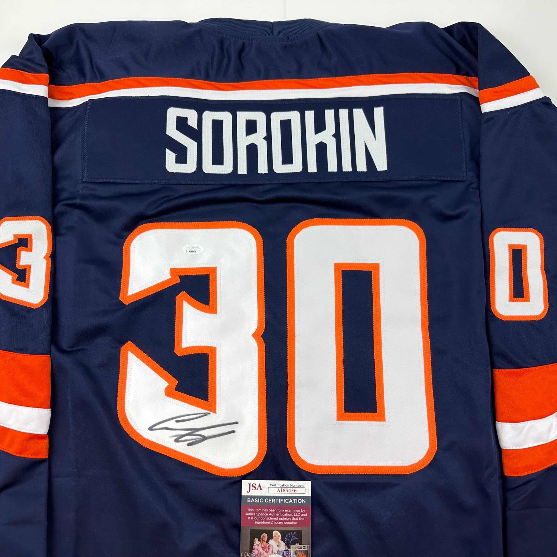 Close-up of navy blue hockey jersey back showing "SOROKIN" nameplate and number 30 with signature and JSA authentication certificate.