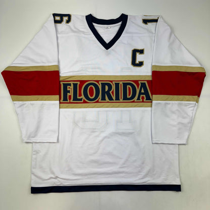 White Florida hockey jersey with red and gold horizontal stripes, displayed flat against gray background, front view.