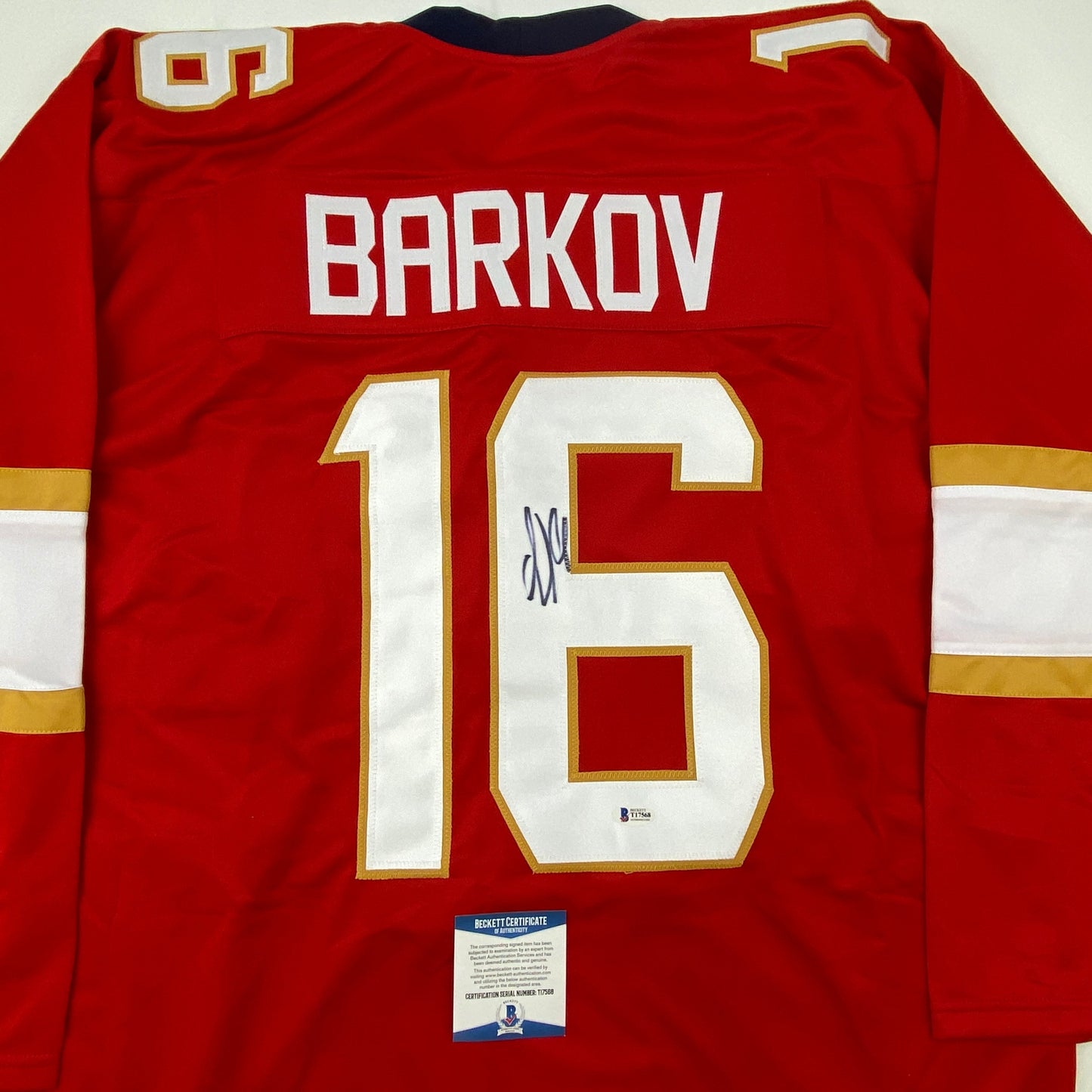 Red Florida hockey jersey with "BARKOV" and number "16" displayed on back, featuring white and gold trim, with Beckett authentication certificate visible at bottom.