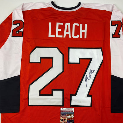 Back view of signed red Philadelphia Flyers hockey jersey #27 with "LEACH" nameplate and JSA authentication certificate visible.