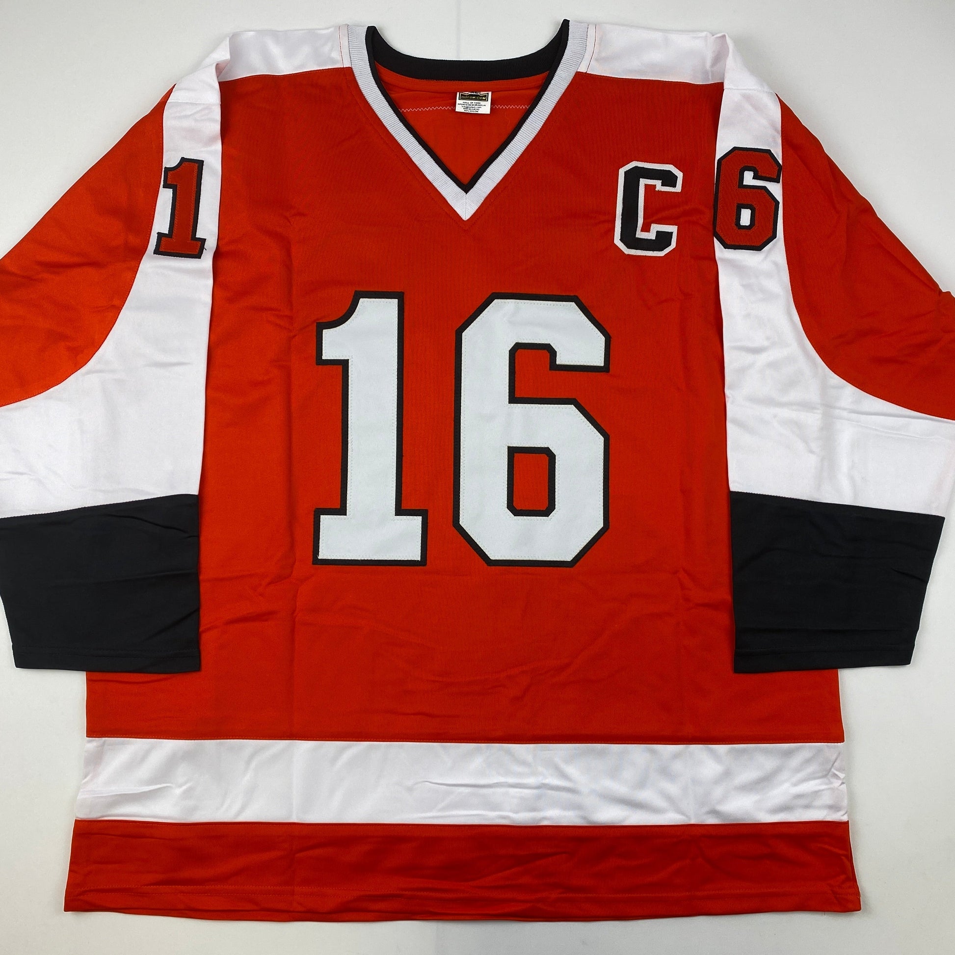Red, white, and black Philadelphia Flyers hockey jersey number 16 displayed flat against white background, front view.