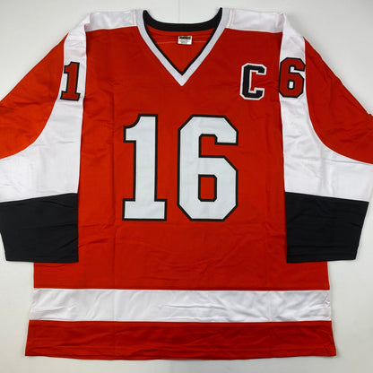 Red, white, and black Philadelphia Flyers hockey jersey number 16 displayed flat against white background, front view.