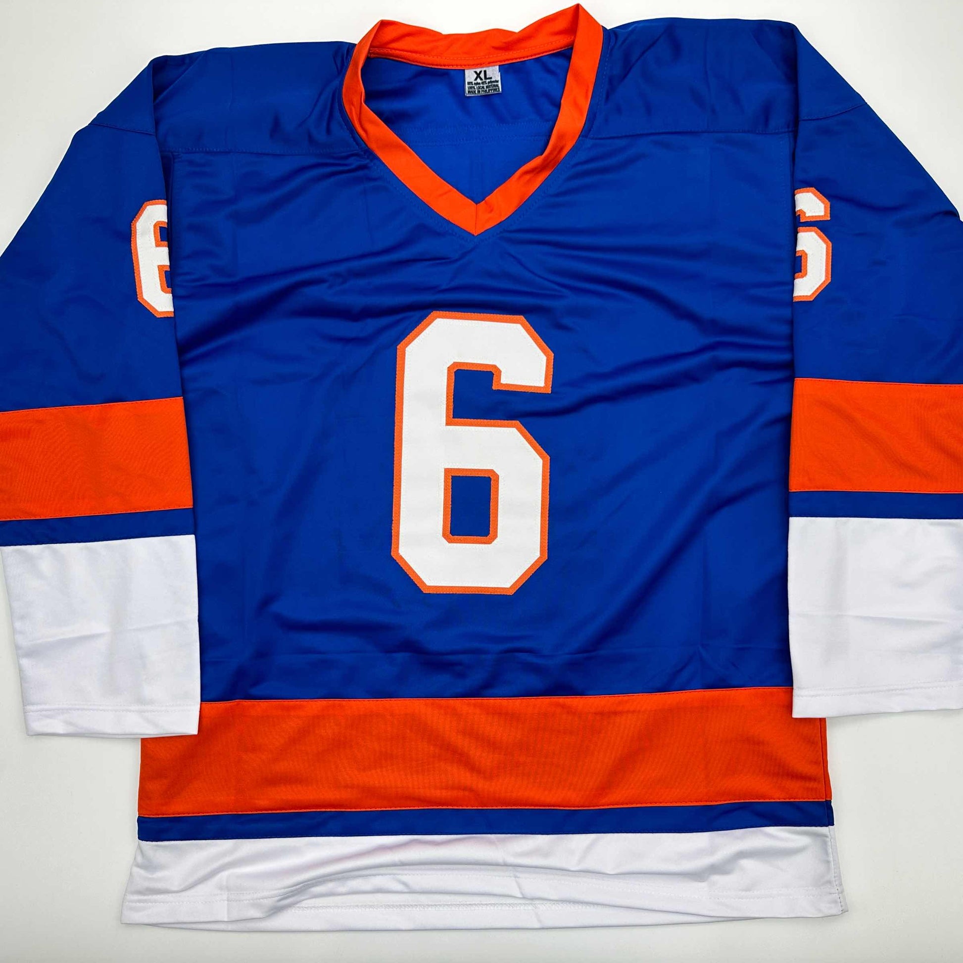 Blue and orange hockey jersey with number 6 displayed flat on white background, showing front view with v-neck collar and striped sleeves.