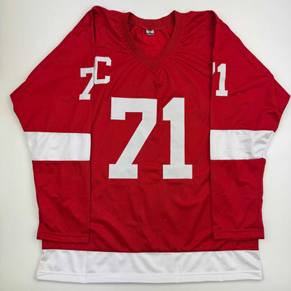 Red Detroit Red Wings hockey jersey with white number 71 and white sleeve stripes displayed flat against white background.