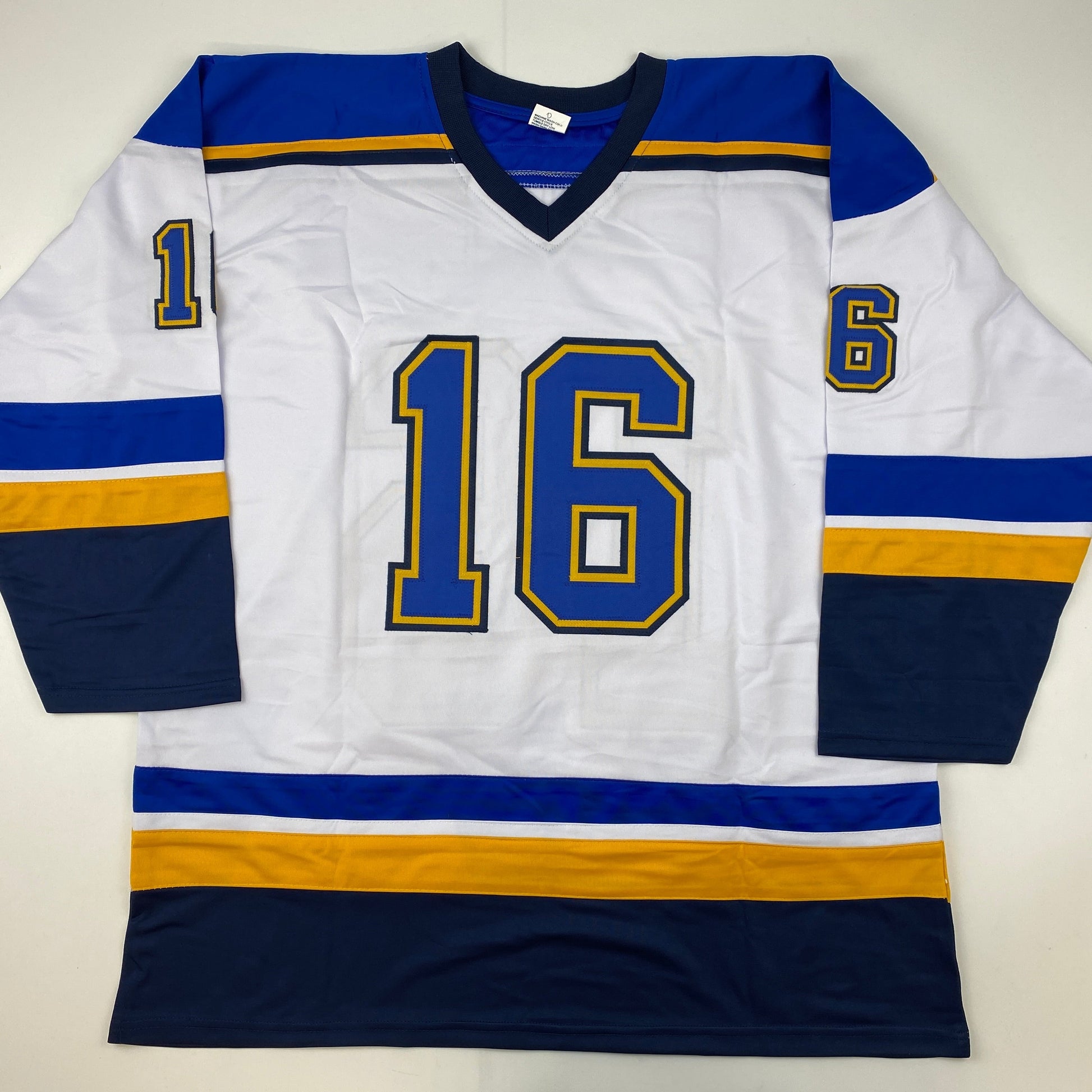 White hockey jersey with blue and gold stripes, number 16 on chest, number 1 and 6 on sleeves, displayed flat against white background.