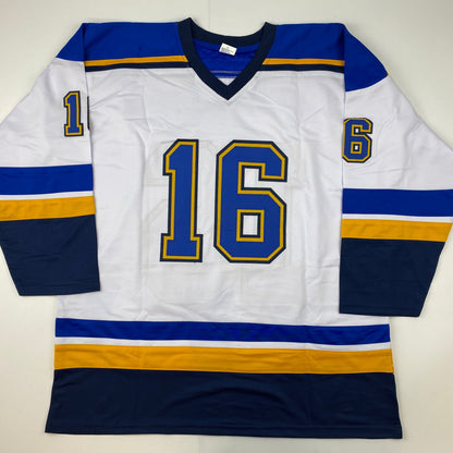 White hockey jersey with blue and gold stripes, number 16 on chest, number 1 and 6 on sleeves, displayed flat against white background.