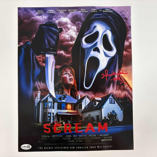 Front of signed 11x14 Scream movie poster featuring masked killer, frightened woman, houses, and purple stormy sky with red title text.