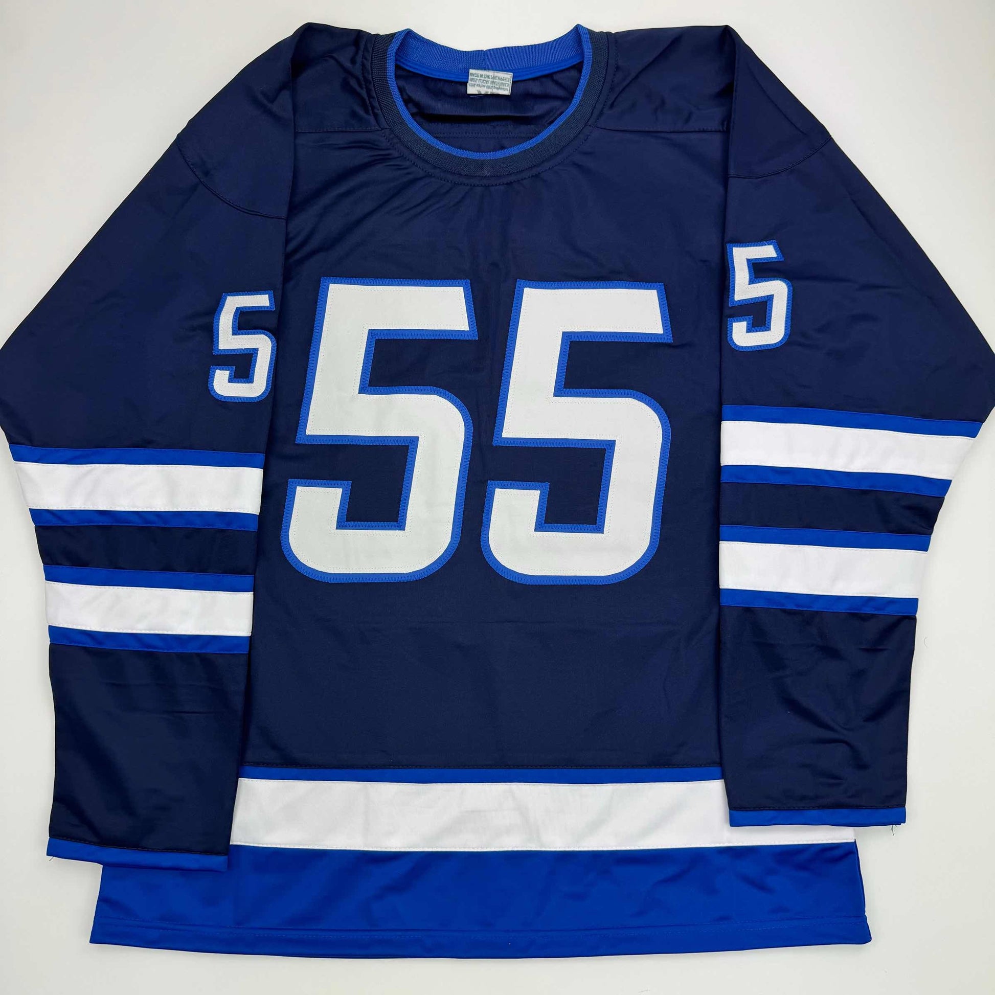 Navy blue hockey jersey with white and blue horizontal stripes on sleeves, large white "55" on chest, displayed flat against white background.