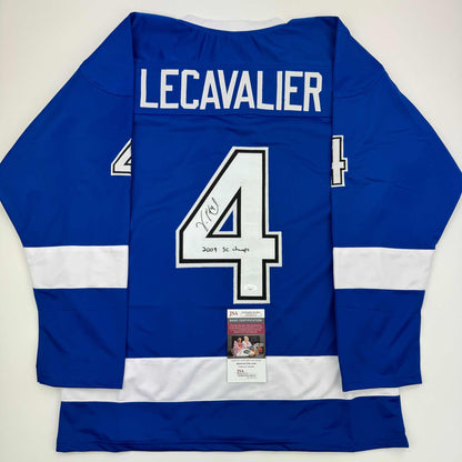 Back view of signed blue and white hockey jersey number 4 with "LECAVALIER" nameplate and "2004 SC Champs" inscription, displaying JSA authentication certificate.