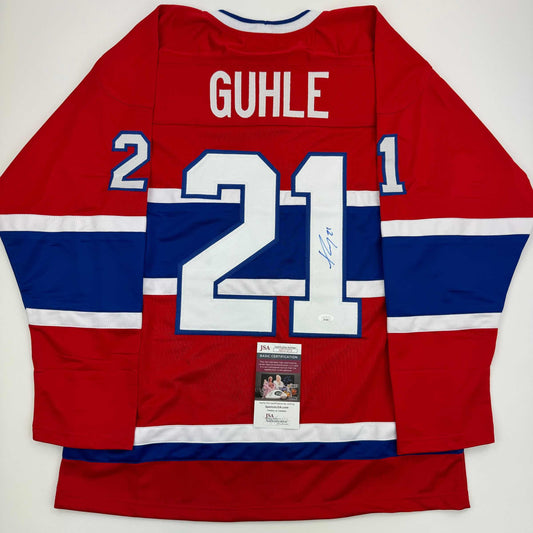 Back view of red, white, and blue Montreal Canadiens hockey jersey with "GUHLE" and number 21, displaying JSA authentication certificate.