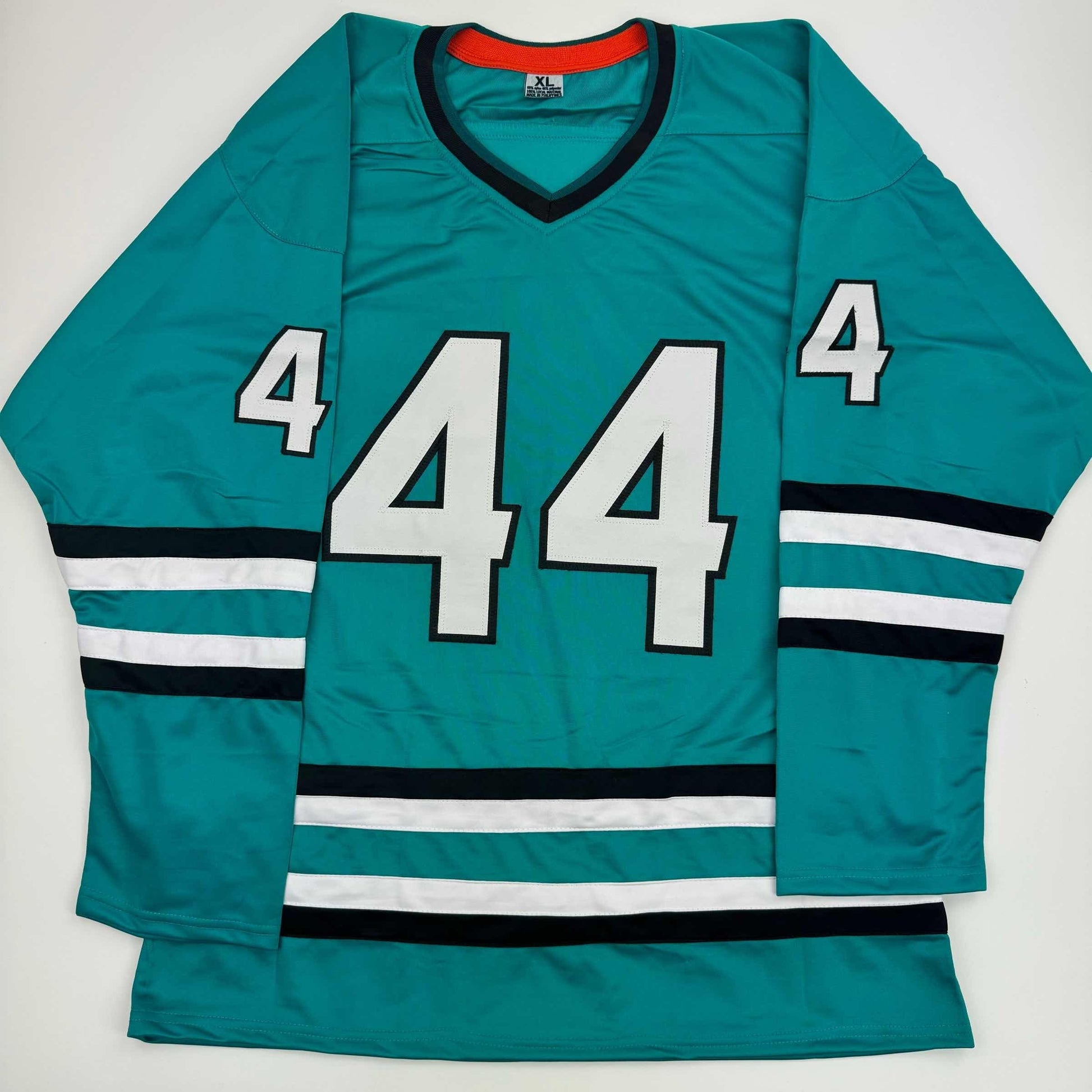 Teal hockey jersey with white number 44, black and white stripe trim, displayed flat against white background.