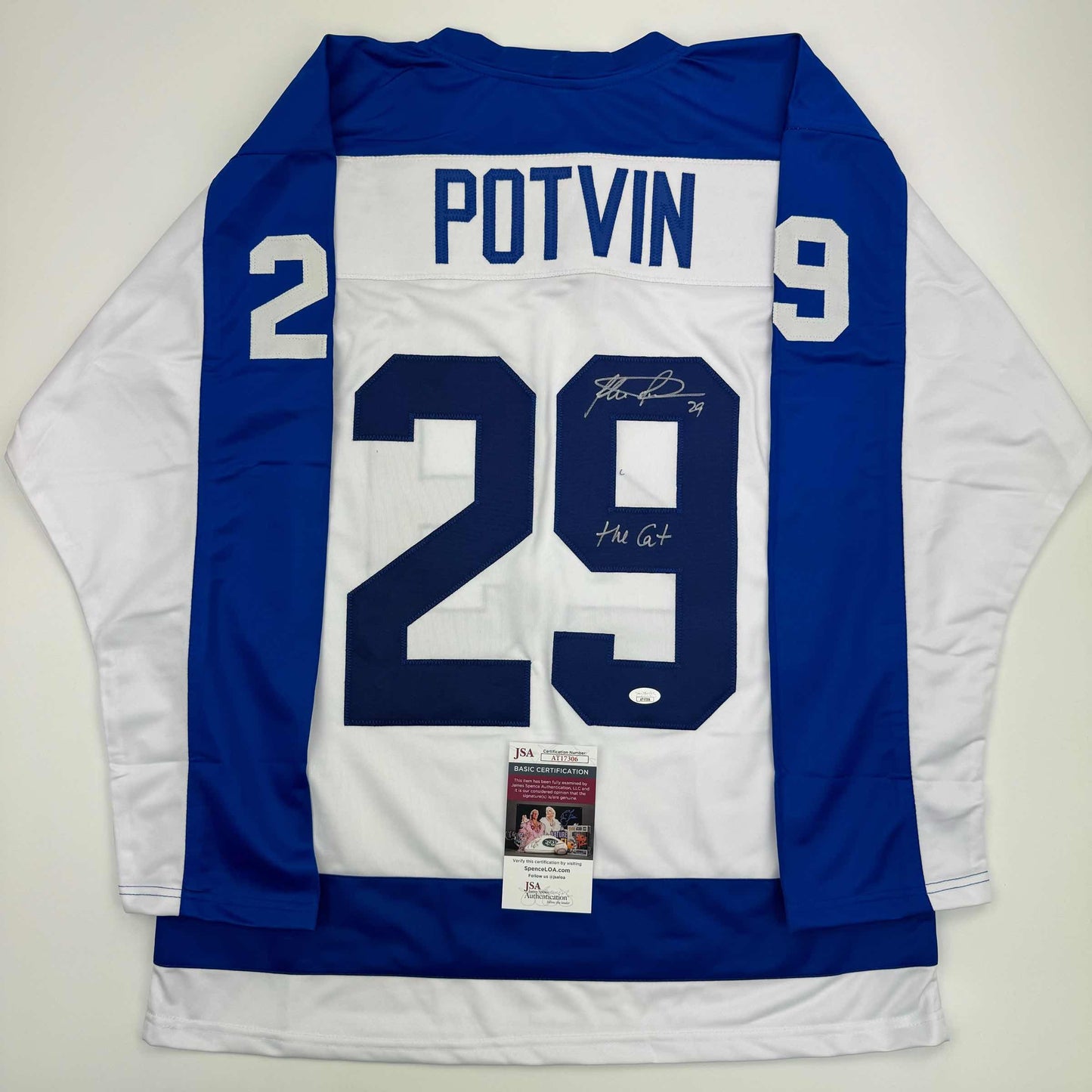 Back view of signed blue and white Toronto hockey jersey #29 Potvin with JSA authentication label attached to hem.