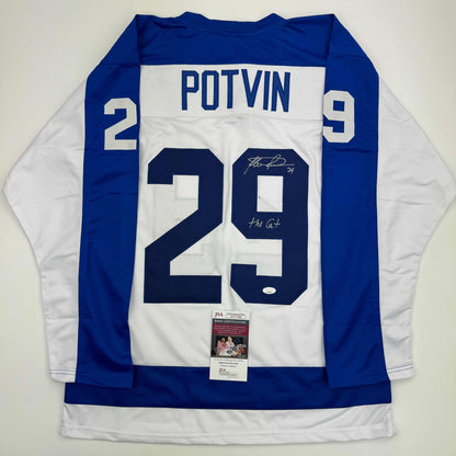 Back view of signed blue and white Toronto hockey jersey #29 Potvin with JSA authentication label attached to hem.