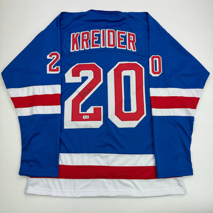 Back view of blue New York Rangers hockey jersey number 20 with Kreider name and autographed signature.