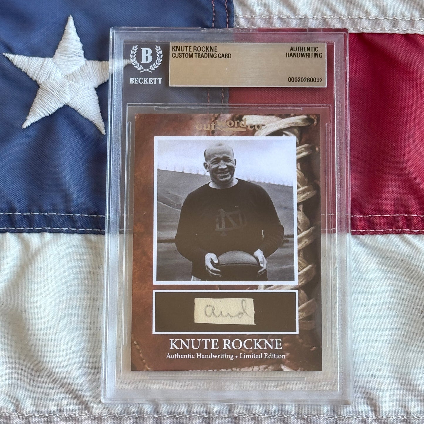 Knute Rockne Beckett Encapsulated Handwriting Removed from his Notre Dame Textbook Signed