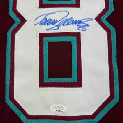 Signed Teemu Selanne Anaheim Ducks retro hockey jersey displaying maroon, teal, and white striped design with authentication sticker.