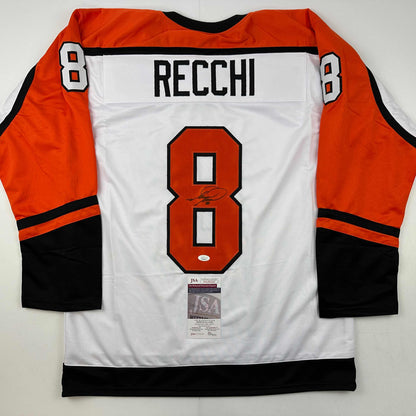 Back view of white Philadelphia Flyers hockey jersey number 8 with "RECCHI" nameplate and signature, orange and black sleeves, JSA authentication sticker visible.