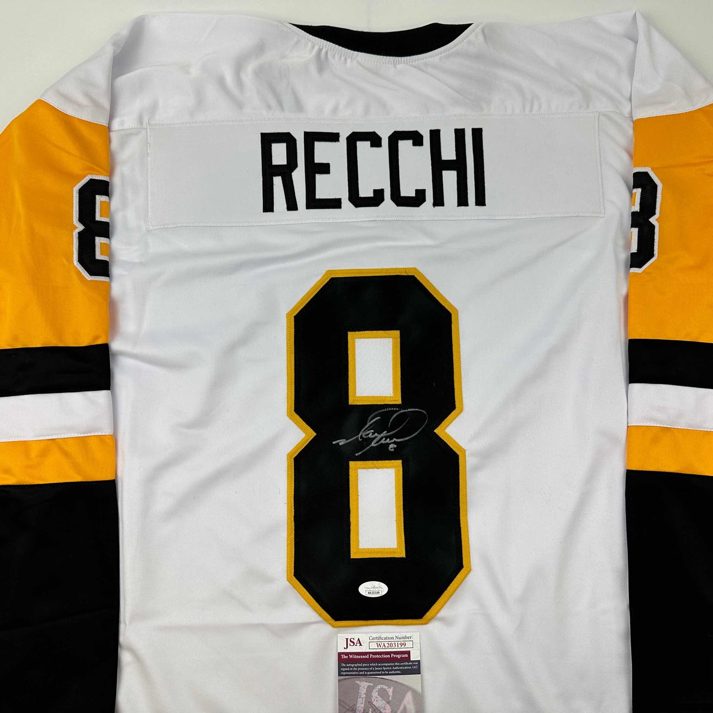 Back view of white Pittsburgh Penguins hockey jersey number 8 with "RECCHI" nameplate and JSA authentication certificate visible.