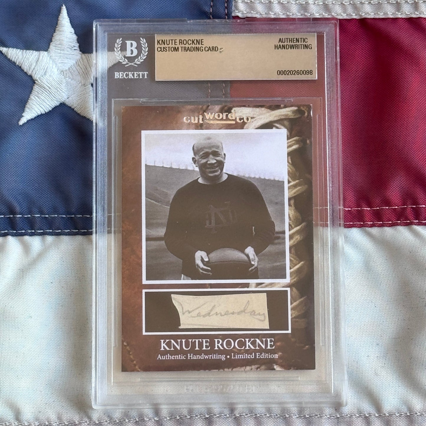 Knute Rockne Beckett Encapsulated Handwriting Removed from his Notre Dame Textbook Signed