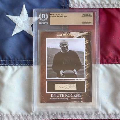 Knute Rockne Beckett Encapsulated Handwriting Removed from his Notre Dame Textbook Signed