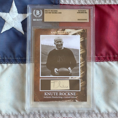 Knute Rockne Beckett Encapsulated Handwriting Removed from his Notre Dame Textbook Signed