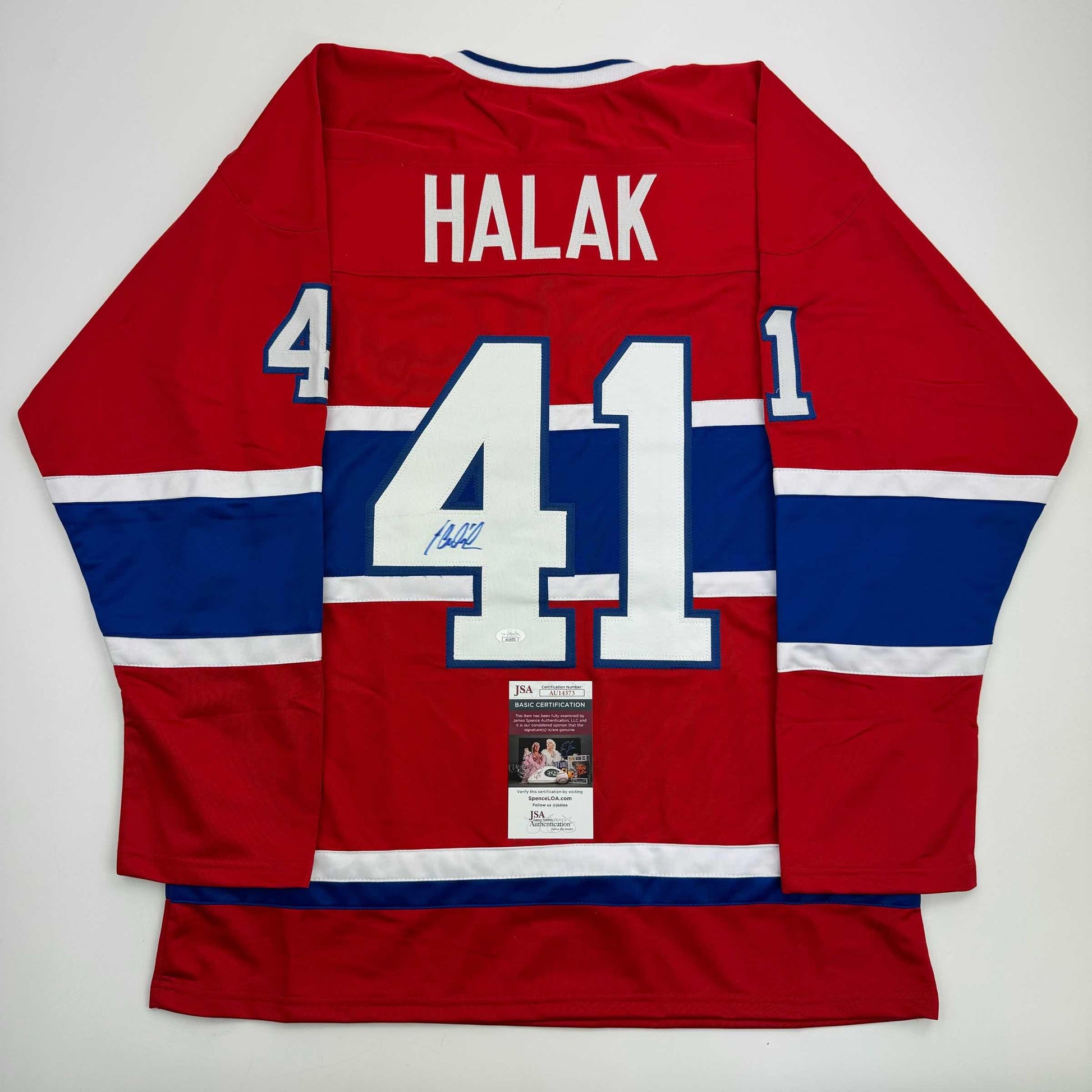 Red and blue Montreal Canadiens jersey number 41 with Halak name and autographed signature, displayed flat with JSA certification label visible.