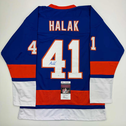 Back view of blue, red, and white hockey jersey with "HALAK" and number 41 printed in orange and white, with JSA authentication certificate visible.