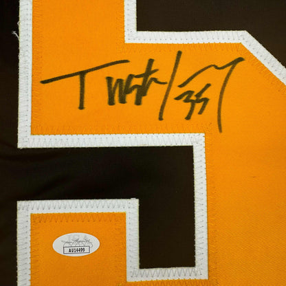 Close-up of handwritten signature "Tristan Jarry" on orange hockey jersey with white trim and JSA authentication sticker.