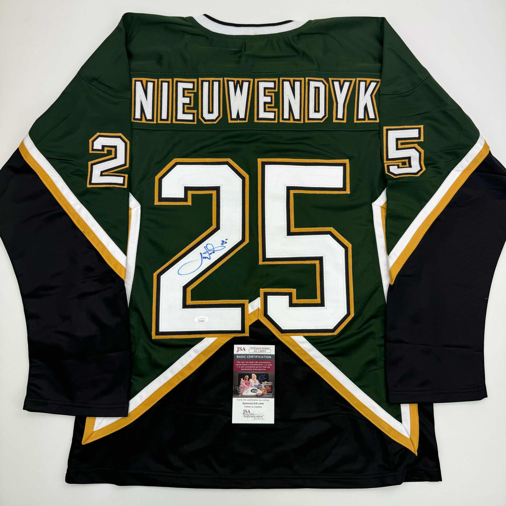 Back view of green and black hockey jersey #25 with "NIEUWENDYK" nameplate and JSA authentication certificate visible.