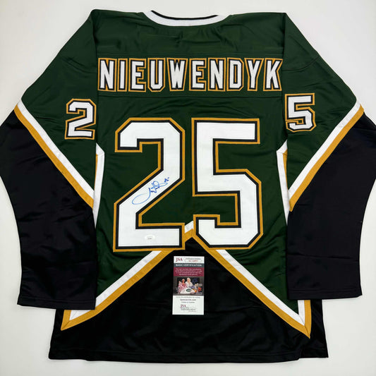 Back view of green and black hockey jersey #25 with "NIEUWENDYK" nameplate and JSA authentication certificate visible.