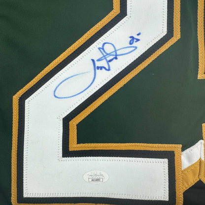 Close-up of signed Dallas Stars green jersey nameplate with blue autograph and JSA authentication sticker visible.