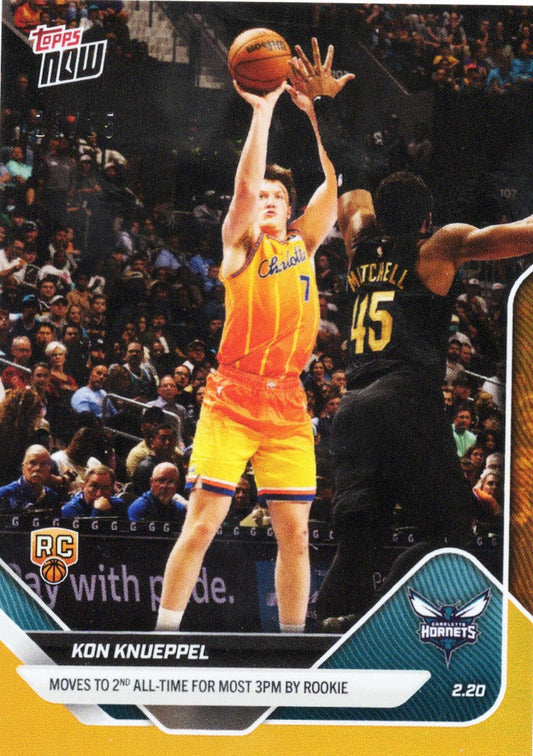 Kon Knueppel shooting a three-pointer in yellow Hornets jersey against defender wearing black, orange foil basketball card.