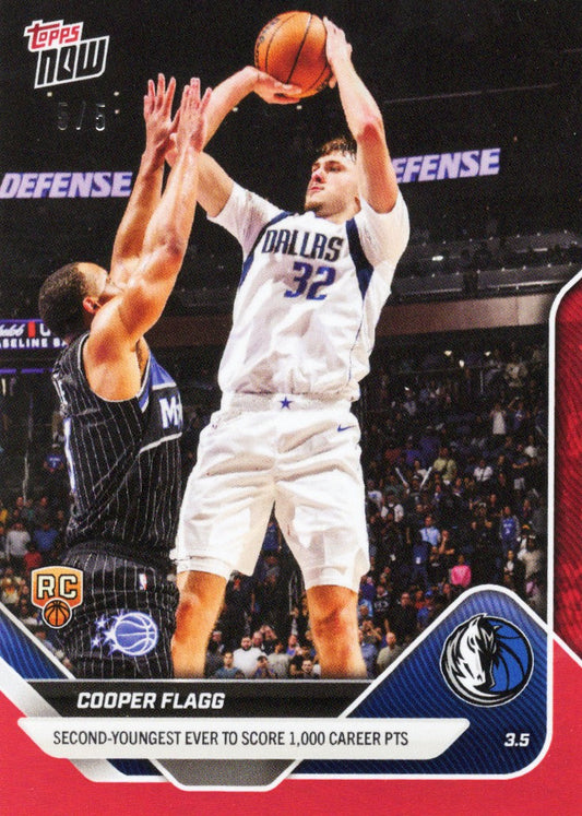 Cooper Flagg in white Dallas Mavericks jersey number 32 shoots over defender in pinstriped uniform during game.