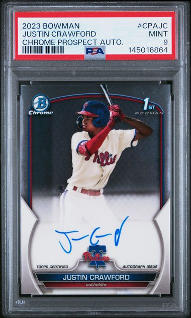 PSA-graded trading card in clear holder showing Justin Crawford in red baseball uniform at bat, with blue autograph and Chrome Bowman branding visible.