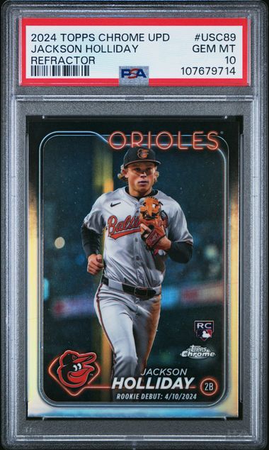 PSA-graded baseball card in protective case showing Jackson Holliday in Baltimore Orioles uniform with refractor finish and red border label.