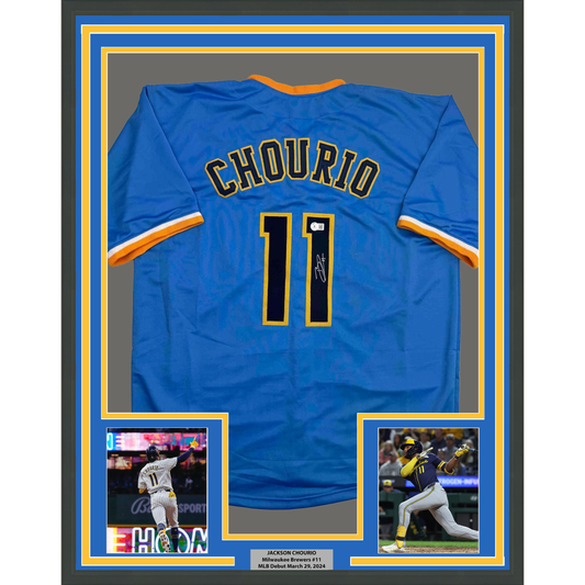 Blue Milwaukee Brewers jersey number 11 with "CHOURIO" name, signed, displayed in framed mount with two action photos below.