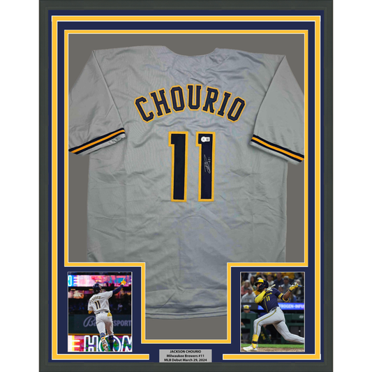 Gray Milwaukee Brewers jersey number 11 with "CHOURIO" name displayed in framed presentation with photos and nameplate.
