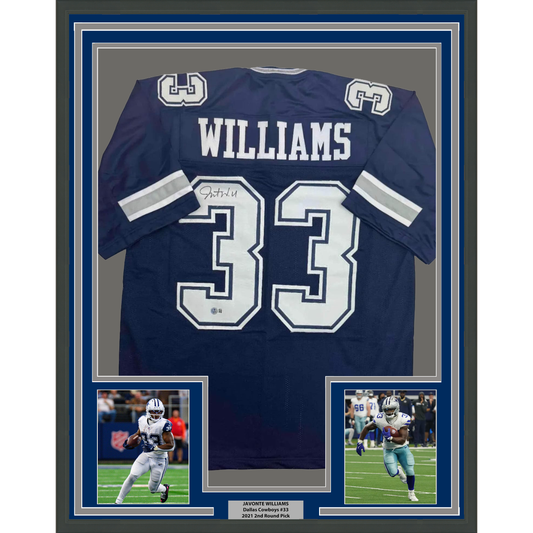 Navy Dallas Cowboys #33 Williams autographed jersey displayed in frame with two action photos and nameplate below.