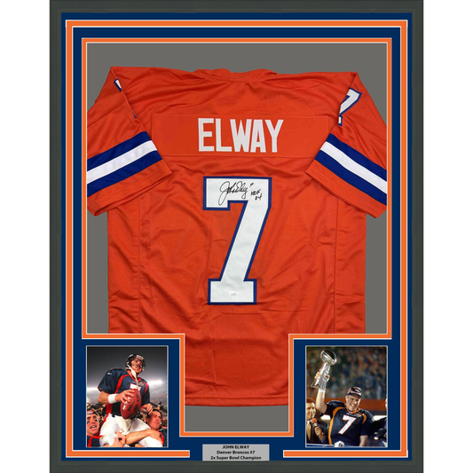 Framed red Denver Broncos #7 jersey signed by John Elway with two accompanying photos and nameplate below.