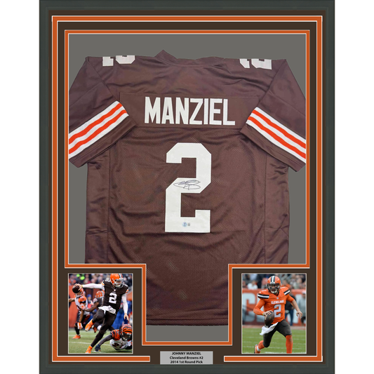 Framed brown Cleveland Browns jersey number 2 signed by Johnny Manziel with orange and white striped sleeves, flanked by two action photos.