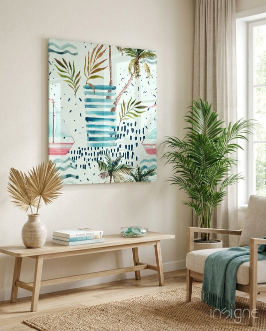 Tropical glass wall art featuring palm fronds, sailboat, and blue watercolor strokes displayed above wooden bench in coastal-themed room.