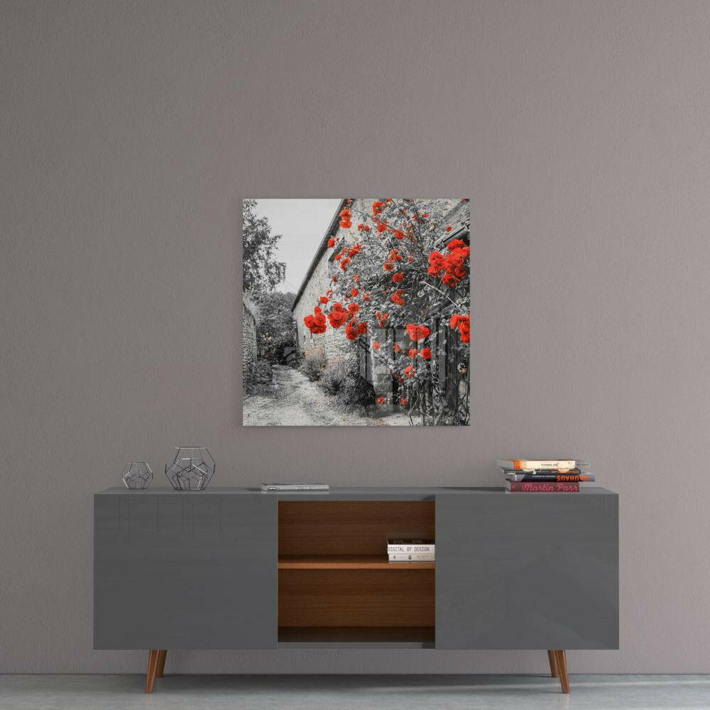 Red Roses Glass Wall Art hanging above gray mid-century modern sideboard with wooden shelving and decorative items.