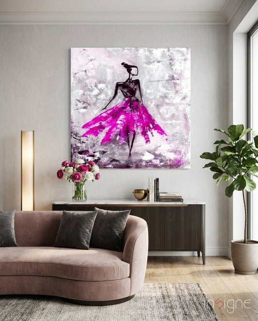 Modern living room interior featuring fuchsia tutu dancer glass wall art above console table with pink sofa and plants.