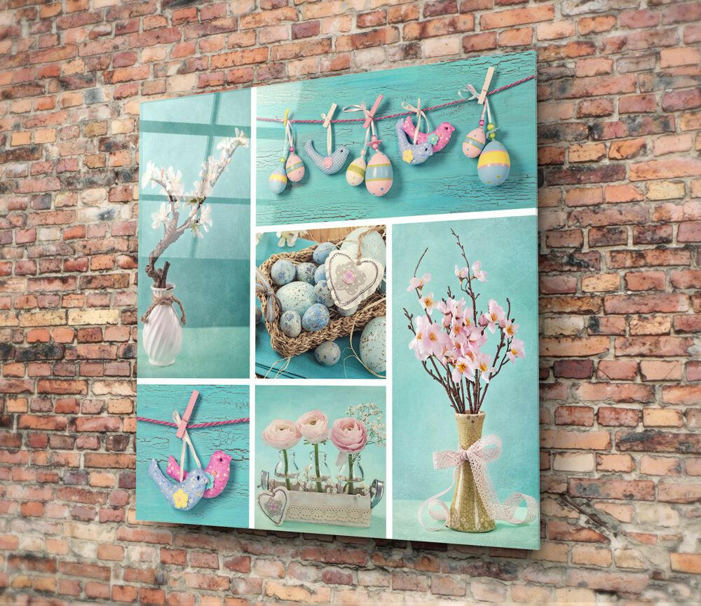 Turquoise glass wall art with nine panels displaying Easter decorations including eggs, flowers, and heart ornaments against a brick wall.