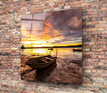 Wooden Rowboat Fiery Lake Sunset Glass Wall Art