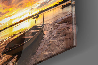 Wooden Rowboat Fiery Lake Sunset Glass Wall Art