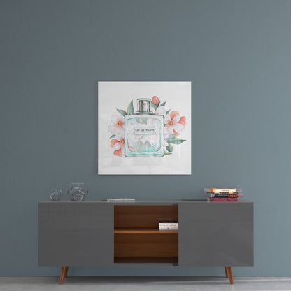 Square watercolor canvas art depicting a perfume bottle surrounded by pink and white flowers, hung above a mid-century modern dresser.