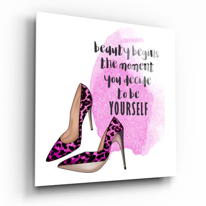 Glass wall art displaying pink leopard print heels with inspirational text "beauty begins the moment you decide to be yourself" on white background.